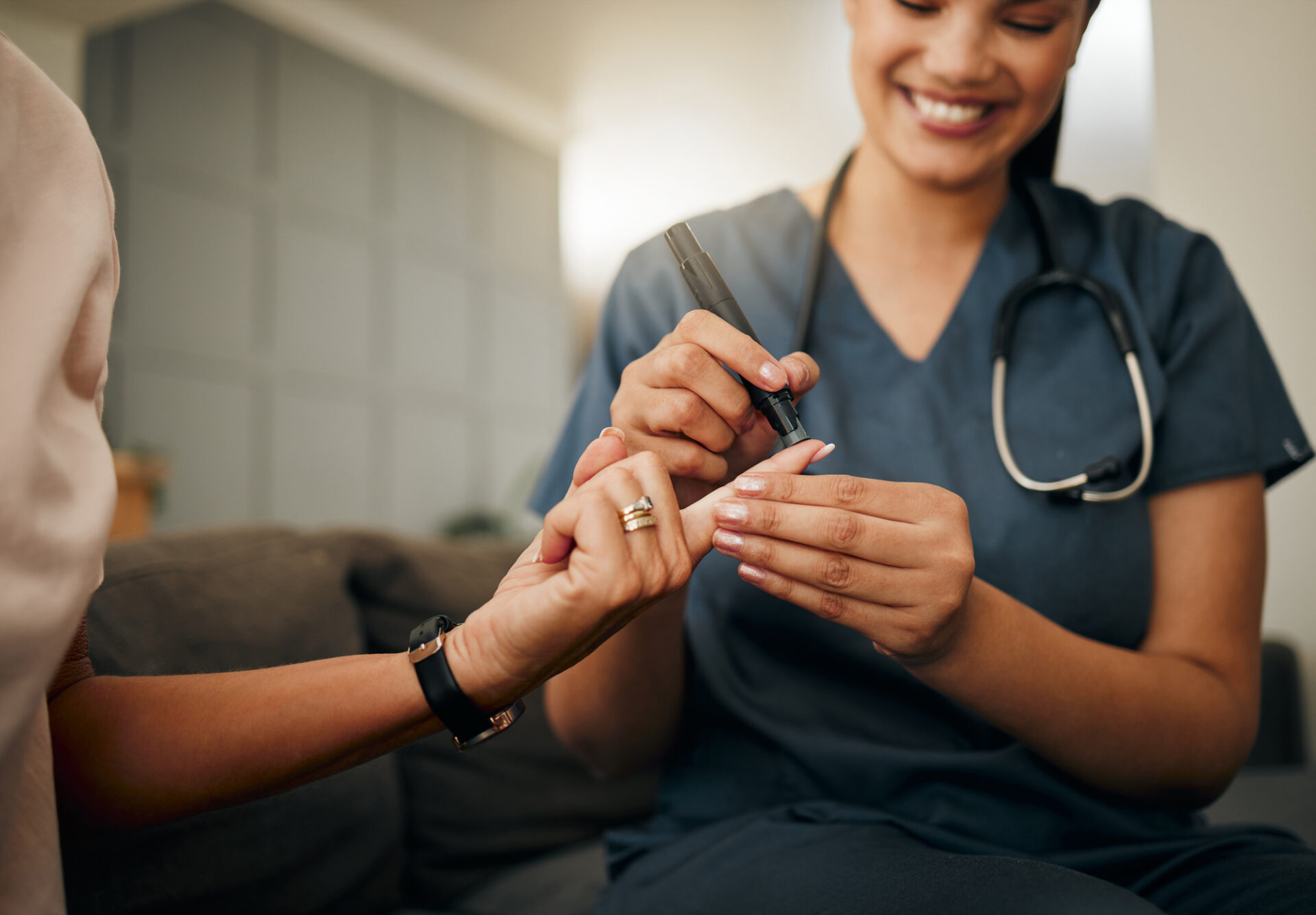 Nurse performing fingerstick blood test during community diabetic eye screening visit in Washington DC